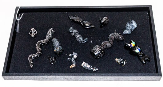 A collection of thirteen carved stone fetishes