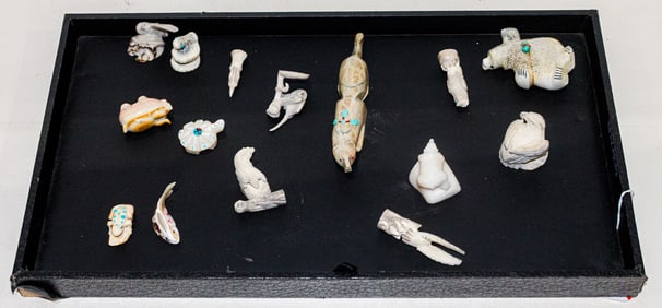 A collection of sixteen carved stone and other festishes