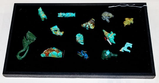 A collection of thirteen carved stone fetishes