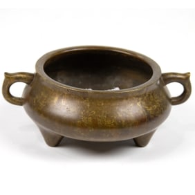 A Chinese bronze tripod censer