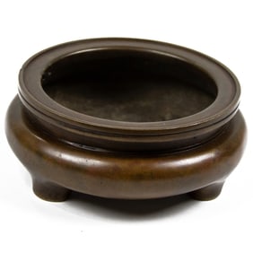 A Chinese bronze tripod censer