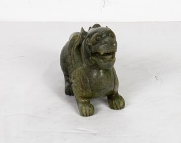 A Chinese celadon jade figure of a pixiu