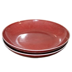 A pair of Chinese copper-red glazed dishes