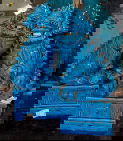 A pair of Chinese turquoise glazed foo dogs