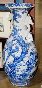 A large Arita blue and white vase with dragon handles