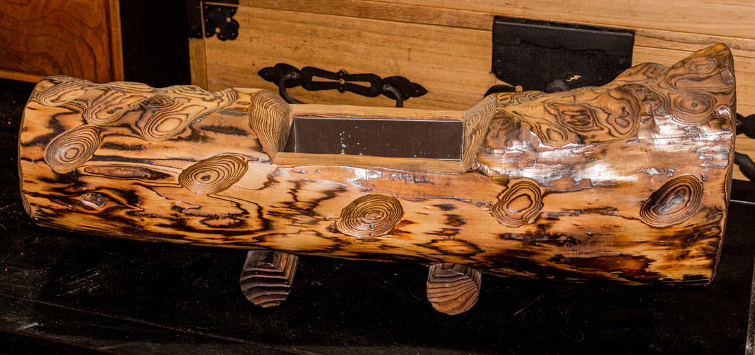 A carved wood ikebana container: A carved wood ikebana container. 20th century, 23.25" wide.