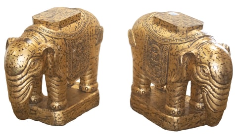 A pair of Thai gold painted elephant coffee table supports