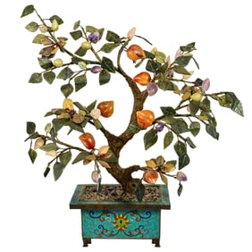 A Chinese cloisonne planter with jade peach tree