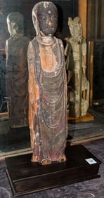 A Chinese wood figure of standing Buddha