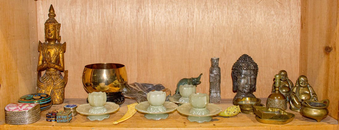 A shelf of Asian decorative objects: A shelf of Asian decorative objects. 20th century, 12.75" tallest.