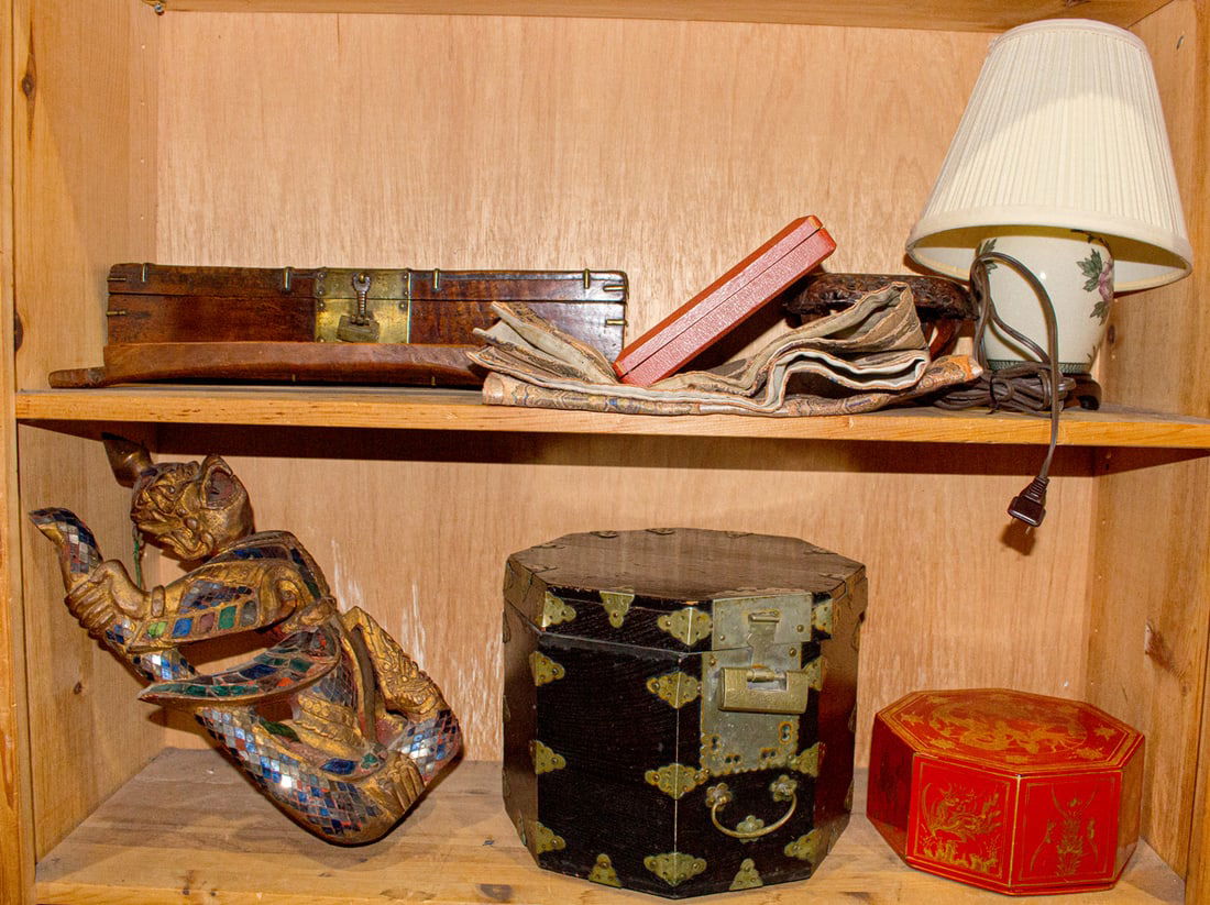 Two shelves of Asian decorative objects: Two shelves of Asian decorative objects. 19th century and later, 17" widest.