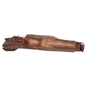 A Southeast Asian wood carving of the dying Buddha