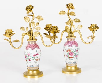 A pair of Louis XV style gilt bronze mounted Chinoiserie decorated porcelain two-light candelabra