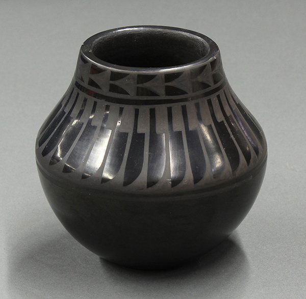 San Ildefonso blackware jar by Blue Corn: San Ildefonso blackware jar by Blue Corn, the bulbous form with traditional feather design wrapping around body, signed Blue Corn/ San Ildefonso Pueblo, 5"h x 5.5"w