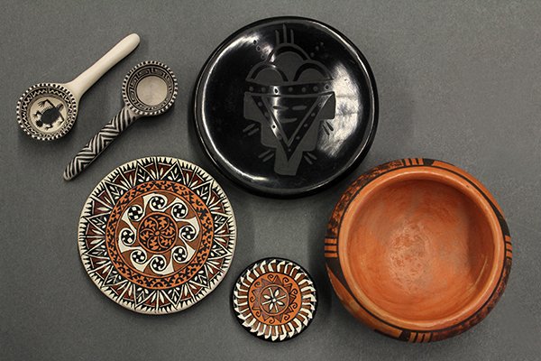 Native American pottery group: (lot of 6) Native American miniature pottery group consisting of a redware bowl, Santa Clara plate, two frog decorated spoons, and two polychrome decorated plates, largest 2.75"w