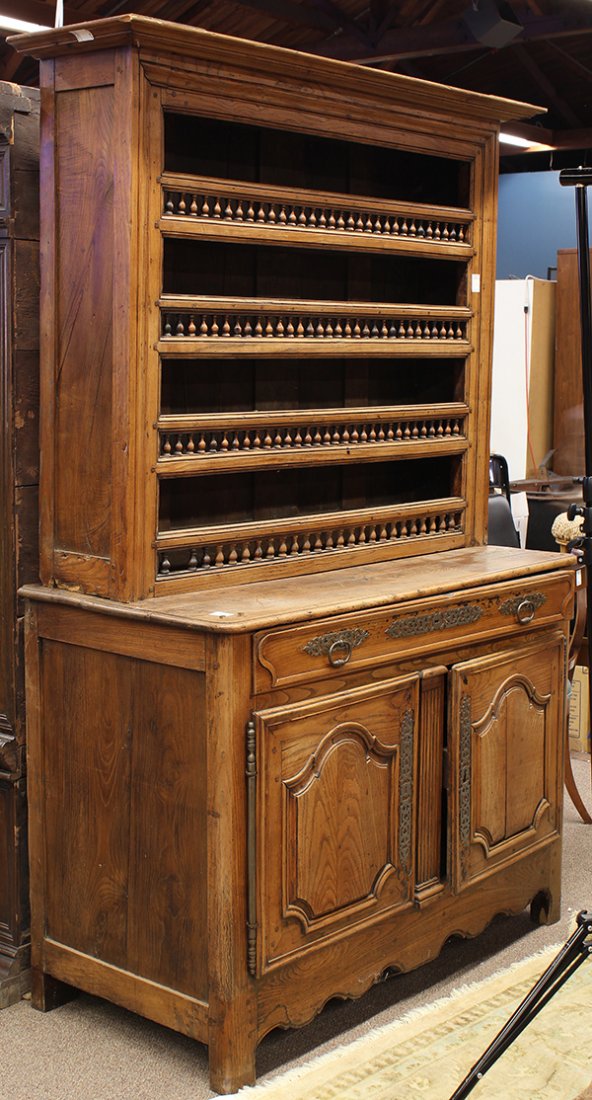French Provincial buffet a deux corps: French Provincial buffet a deux corps, circa 1810, the fitted superstructure with turned supports surmounting the lower case having panelled doors and rising on square legs, 83"h x 54"w x 23"d