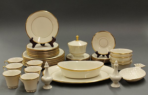 Eternal china by Lenox: Eternal china by Lenox. Partial service for 8 in ecru with 24k banding. Consisting of: 8 dinner plates 10.5"dia., 9 luncheon plates, 6 bread plates, 6 cups and saucers, 4 bowls, 1 oval vegetable, 1 pl