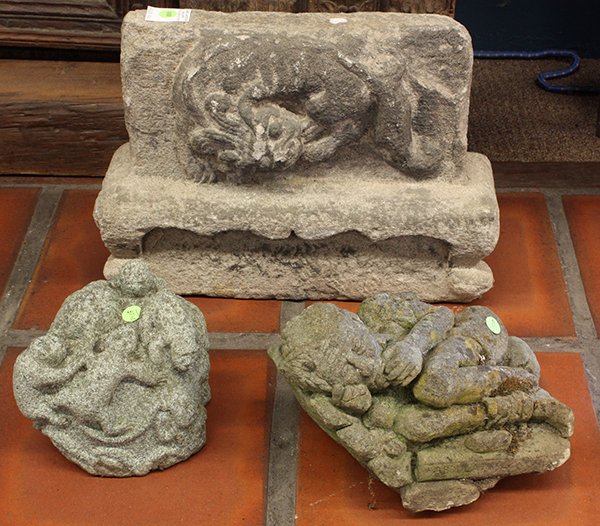 Asian cement/stone garden elements: (Lot of 3) Asian cement/stone garden elements, one depicting a resting male, one depicting frogs on a naturalistic rock, and one a wall fragment with a lion, largest 13"h x 18"w