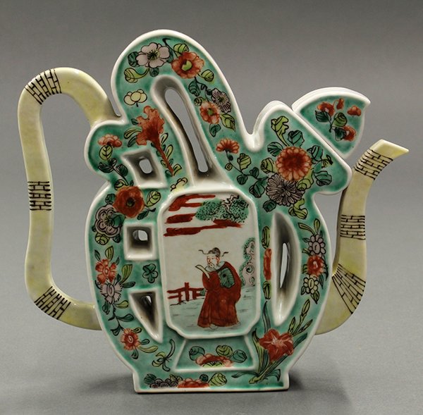 Chinese Porcelain Puzzle Pot: Chinese enameled porcelain puzzle pot, late Qing/early Republic period, in the form of the character 'fu' with various flowers on a green ground and centered with a reserve of Shoulao, and reversed wi