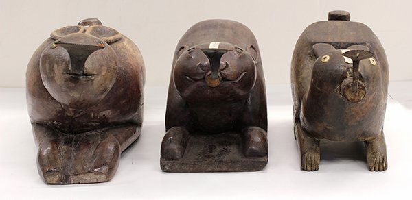 Thai Wood Rabbit Coconut Graters: (lot of 3) Thai wood coconut graters in form of rabbits, two with inlaid eyes each with metal graters, 21" l