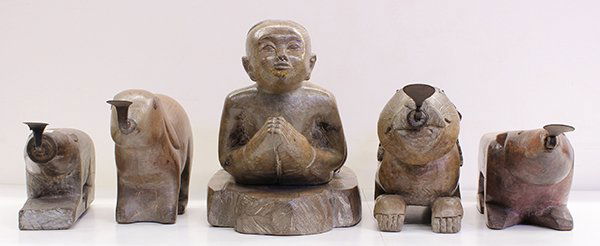 Five Thai Coconut Graters and Step: (lot of 5) Thai wood coconut graters and a step, consisting of four rabbit form; together with a step in the form of a child with hands clasped to the front, 22.5"l