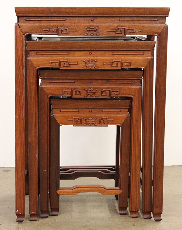 Set of Chinese Nesting Tables: (lot of 4) Chinese wooden nesting tables, each with a floating top panel, with a apron centered with a shou emblem and accented by scrolls, largest: 27.6"h