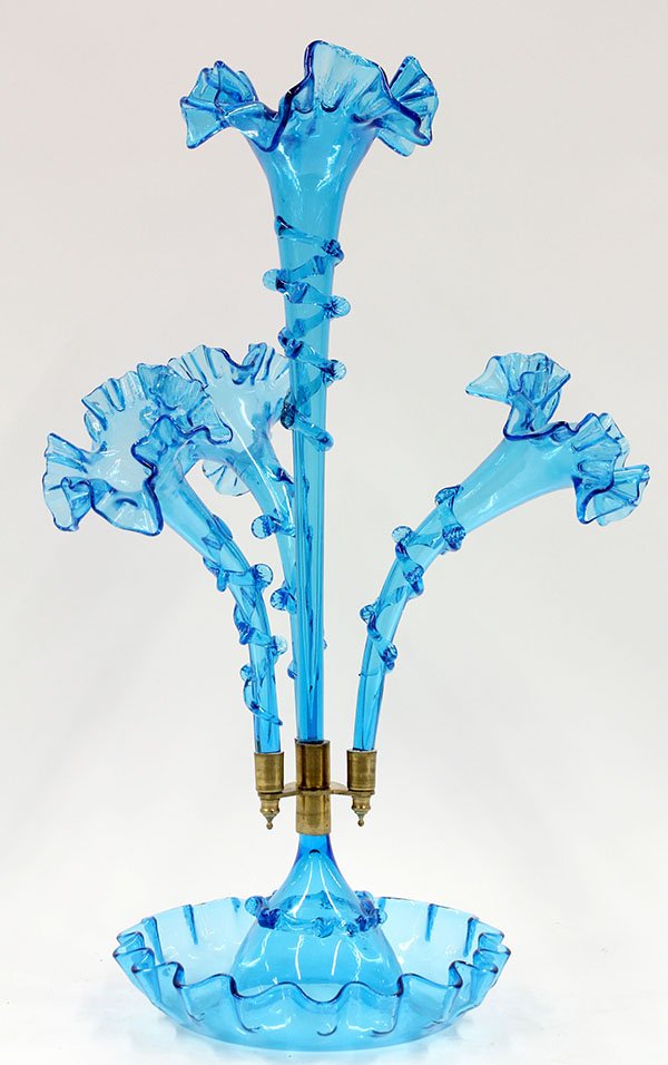 Victorian style art glass epergne: Victorian style art glass epergne, the four arm centerpiece executed in periwinkle glass and having a scalloped rim above the trumpet form body accented with applied floral banding and rising on a sha