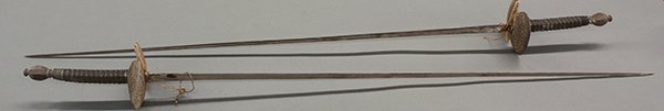 Pair of Continental foils: Pair of Continental foils, possibly German, each having shaped and pierced cross-guards, and mounted with wire wrapped shagreen grips, 42"l. Provenance: Property from the Estate of Frank N. and France