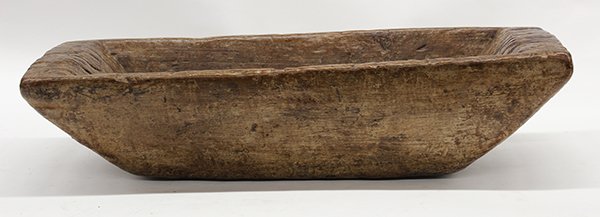 Southeast Asian teak wood trough and dough bowl: (lot of 2) Southeast Asian wood carvings including a Thailand teak trough with stump handle, 6"h x 30"l x 8.5"d; together with an Indonesian dough bowl of trough form, 6"h x 26"w x11"d
