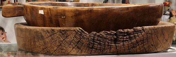 Southeast Asian teak serving bowl and tray: (lot of 2) Southeast Asian teak wood carvings of indigenous form including a handled serving bowl, 5"h x 25"l x 22"diam.; together with a shaped driftwood tray, 24" x 24.5"
