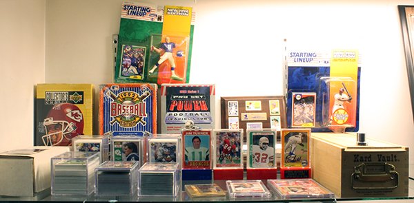 Three shelves of baseball and football cards: Three shelves of baseball and football cards, some autographed including John Burkett rookie card limited edition 18/1990, Brent Jones, Ruben Sierra, Todd Benzinger, Rick Honeycutt, Mike Aldrete, Terr