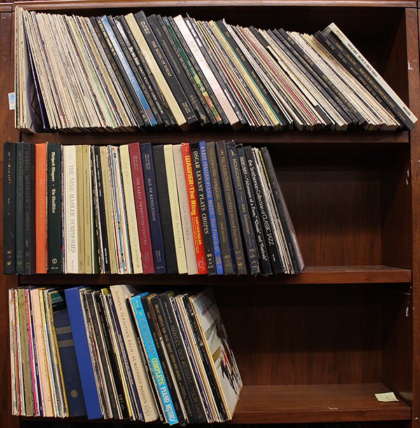 Three shelves of mostly Classical albums and album coll: Three shelves of mostly Classical albums and album collections including works by Bach, Tchaikovsky, Paganini, Wagner, Debussy, and Handel.