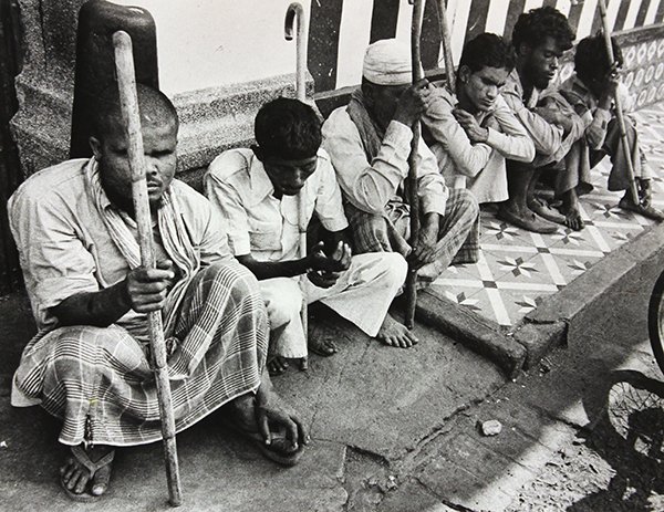 Photograph by Leon Levinstein: Unframed gelatin silver print, Untitled (Resting Porters), by Leon Levinstein (American, 1913-1988), paper: 11''h x 14''w. Provenance: Deaccessioned from The Museum of Fine Arts, Houston