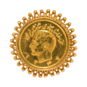 A gold coin and 18k gold ring