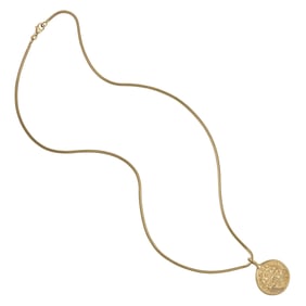 A gold coin and gold pendant necklace