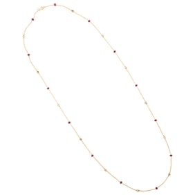 A ruby, topaz and 18k gold station necklace