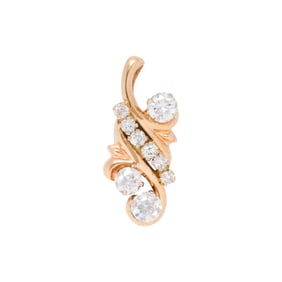 A diamond and 14k gold pendant
