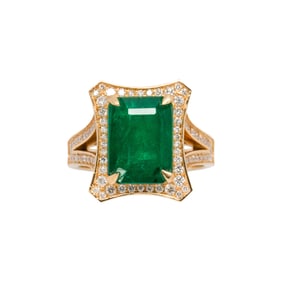 An emerald, diamond and 18k gold ring
