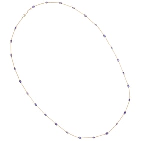 A tanzanite and 18k gold station necklace