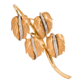 A diamond and 14k bi-color gold brooch