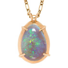 An opal and 14k gold pendant necklace