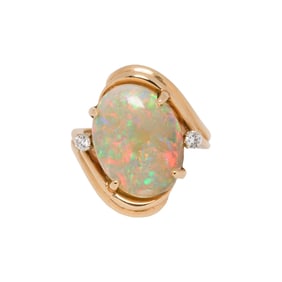 An opal, diamond, and 14k gold ring