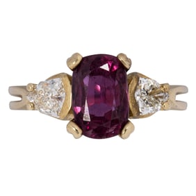 A ruby, diamond, and 14k gold ring