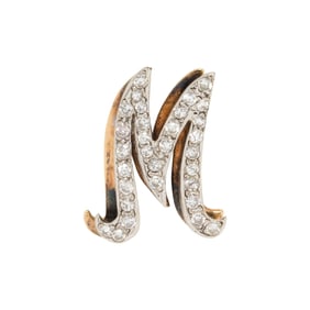 A diamond and 14k bi-color gold inital pendant