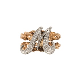 A diamond and bi-color 14k gold initial ring