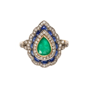 An emerald, sapphire, diamond, platinum, and 14k gold ring