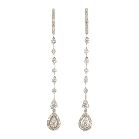 A pair of diamond and 14k white gold earrings