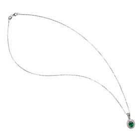 An emerald, diamond and white gold pendant necklace