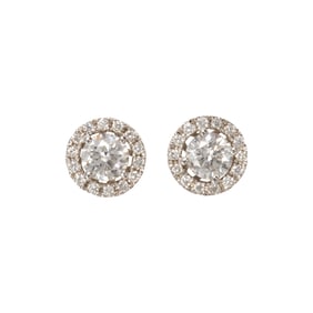A pair of diamond and 14k white gold stud earrings