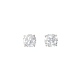 A pair of diamond and 14k white gold solitaire earrings